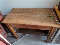 Top view of oak workbench table showing plank surface and wear