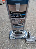 Front close-up of Shark Rotator Powered Lift-Away base and branding
