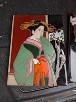 Front of first glazed ceramic geisha tile