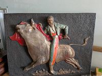 Front view showing entire matador and bull sculpture, colors and texture visible