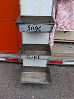 Full view of wall-mounted planter showing three boxes and Sage label