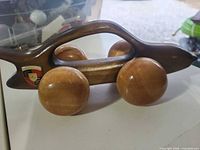 Left side view showing overall shape, wheels, and crest