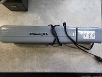 Full view of PowerXL vacuum sealer showing brand logo and power cord