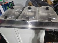 top view showing unit with three covered pans