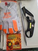 Lot overview showing gloves, rod runner, headlamp, hand warmers