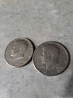 Obverse of both coins showing 1974 and 1978 dates