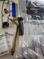 Overview showing torch components, gloves, safety plates