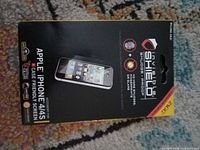 Front of sealed Zagg InvisibleShield Smudge Proof packaging showing compatibility with Apple iPhone 4/4S