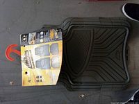 Packaged Armor All 4-piece rubber floor mats showing product details