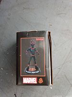 Front of retail box showing Black Panther bobblehead image and Marvel branding