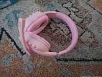 Full view of pink headset folded