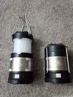 Two collapsible Cascade Mountain Tech LED lanterns, one extended, one collapsed