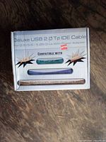 Front view of retail box for USB 2.0 to IDE/SATA adapter cable kit