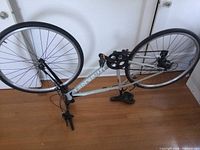 Full inverted view showing frame, wheels, drivetrain