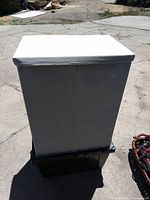 Closed gray fabric hamper with lid