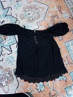 Front view showing blouse design, sleeves, button placket, lace hem