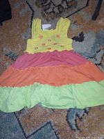 Front view of sleeveless tiered toddler dress