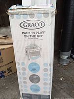 Front of sealed Graco Pack 'N Play On The Go box