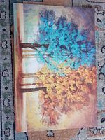 Front view of the hand-painted canvas showing full artwork of trees with blue and golden foliage