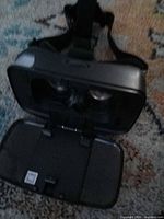 Open phone tray displaying interior lenses