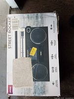 Front of sealed retail box showing product image and model name