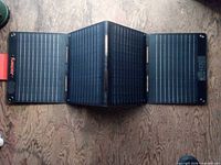 Jackery tri-fold solar panel fully opened showing three connected photovoltaic sections