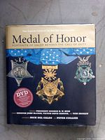 Front cover of Medal of Honor hardcover showing title, authors, and DVD sticker