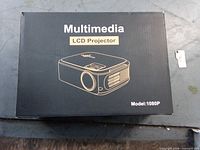 Front of box showing projector illustration and model 1080P