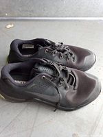 Side view of both shoes showing overall condition, materials, and Nike branding