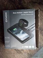 Front view of Nomad Base Station Apple Watch Wireless Charging Dock retail box
