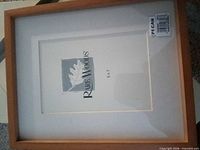 Frame front showing brand insert and pecan wood finish