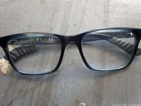 Front view of Ray-Ban black rectangular eyeglasses with clear lenses