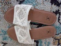 Top view of both sandals showing macramé straps, footbeds, size and brand markings