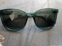 Front view of green oversized sunglasses