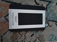 Front of packaged Bytech Tablet Folio Case