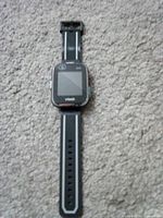 Front view of VTech Kidizoom Smartwatch DX2 showing screen, camera lens, and strap