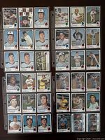 Overview of four binder pages showing all baseball cards in lot
