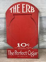 Front view of red cardboard The ERB 10¢ cigar display sign