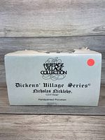 Front of original Heritage Village Collection box