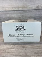 Box end panel showing Heritage Village Collection branding and product name