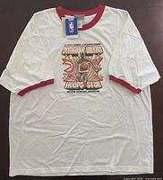 Front view of T-shirt showing graphic and tags