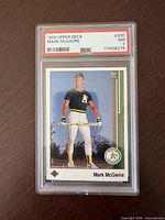 Front of encapsulated 1989 Upper Deck Mark McGwire card showing PSA label and card image