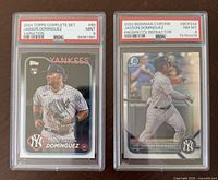 Both PSA graded cards side by side in slabs
