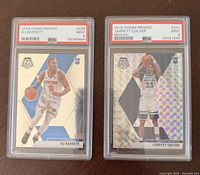 Both PSA-slabbed cards side by side