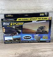 Front of sealed retail box showing Bell + Howell TacVisor features