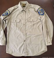 Full view of khaki CHP uniform shirt front