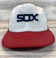 Front view showing SOX logo, red brim, white front