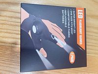 Front of sealed retail box showing illustration and product claims