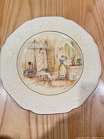 Front view showing full plate, embossed border and illustration