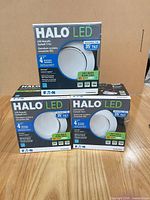 Front of three HALO LED trim boxes showing main specs